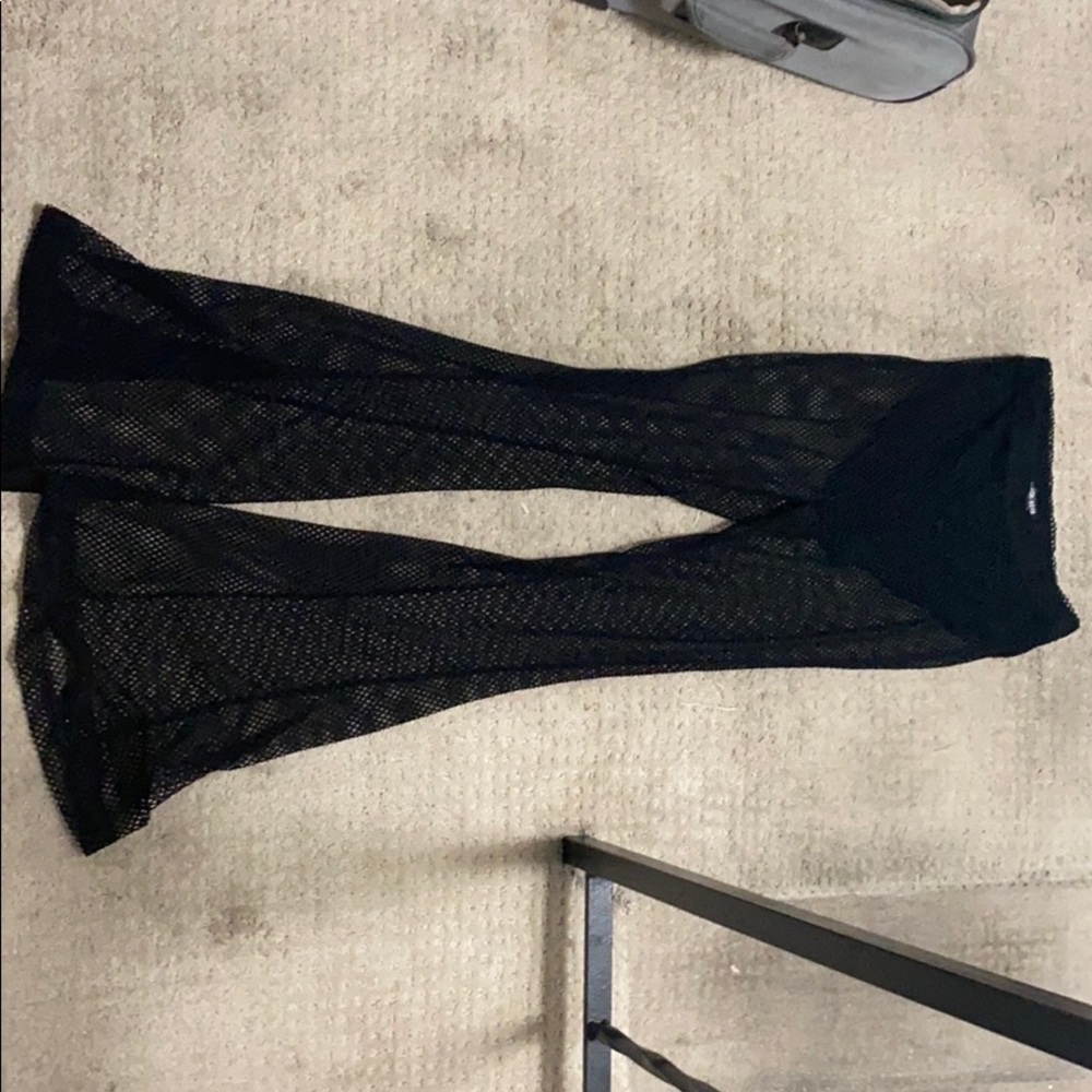 Fashion Nova black fishnet bell bottoms